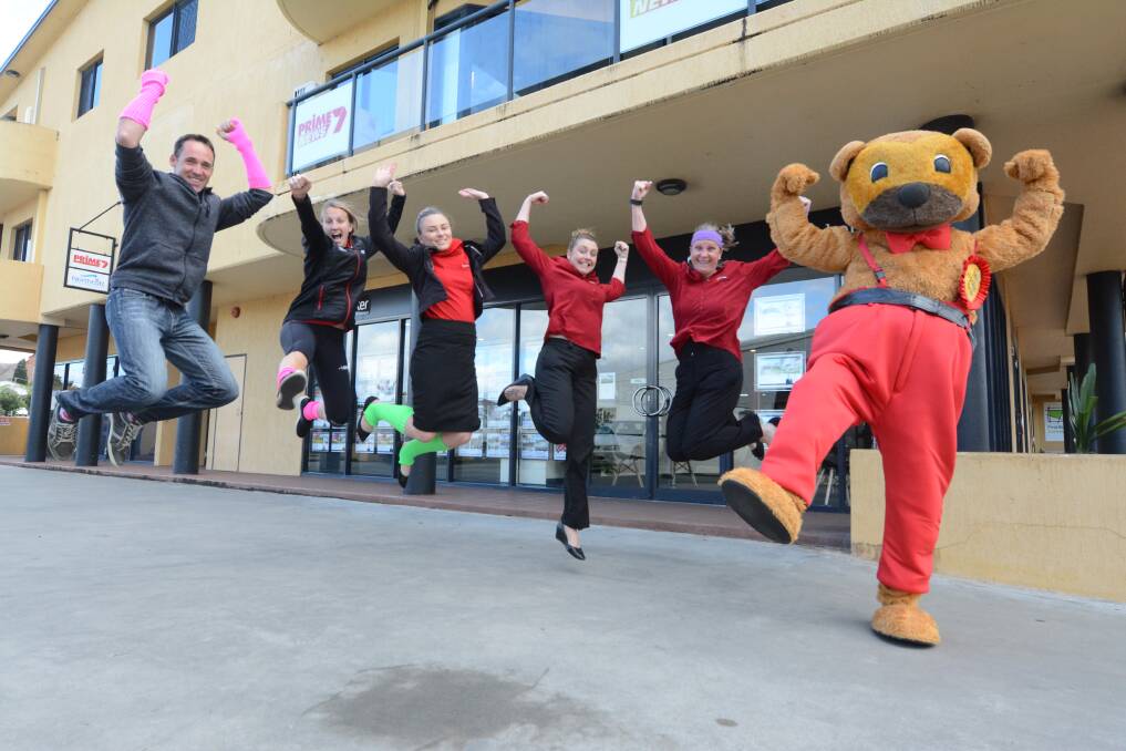 Jump into it: Mick Moylan, Holli Wheeler, Yvette Gillett, Emma Newell, Jayne Black and Hooker Bear are excited for the start of the challenge.