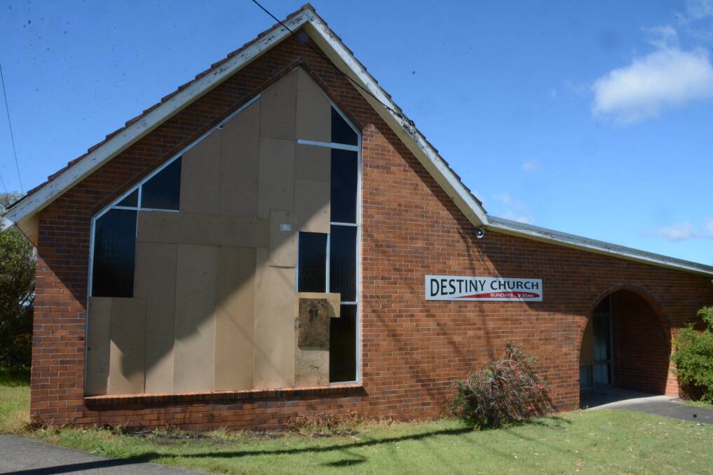 The Destiny Church on High Street, Taree, is boarded up following a fire on Sunday morning. Police have arrested and charged a man following the fire.