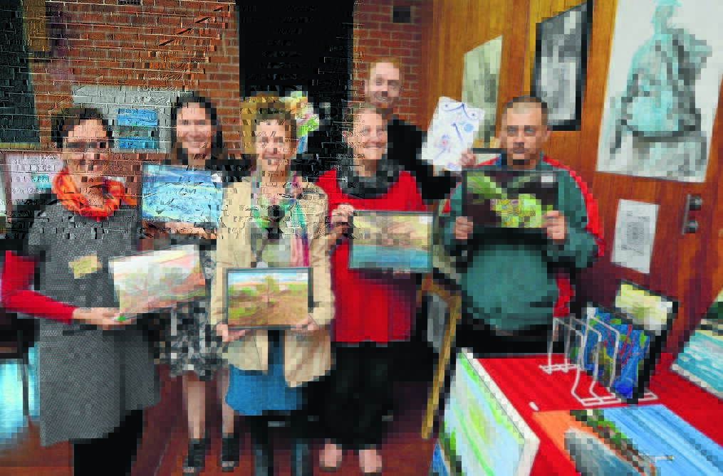 Pictured last year: Event co-ordinator Kirsten Olsen, Elizabeth Kempers, Linda Chudy, Carol Williams, Timothy Douglas McLean and Kane Holman with some of the artwork on display during Brushes with Life in 2015.