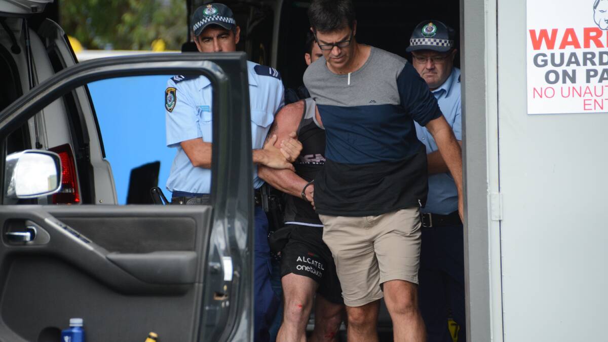 Dean Simpson is arrested at his Taree business on March 1.