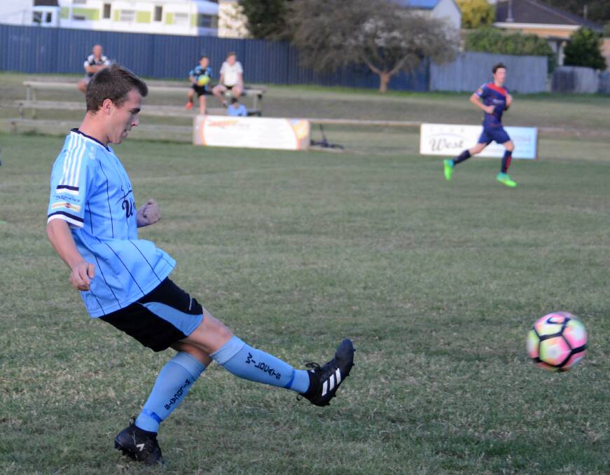Lachlan Brown promotes the ball for Taree during a premier league clash against Wauchope at Omaru Park. The Wildcats will host Tuncurry-Forster tomorrow.