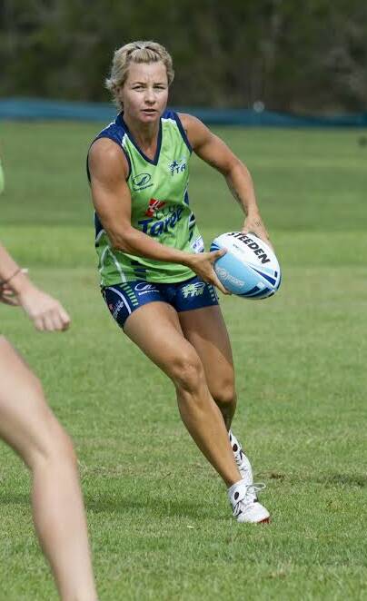 Kylie Hilder looks for support playing in a State cup touch football match.