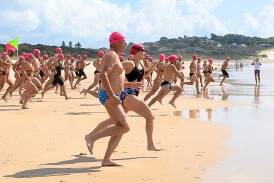 Swimmers head to the surf for the start of the Dorsal Club2Club ocean swim. The event will be held on Sunday,