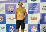 Dylan Kinkaid on the dais with his bronze medal after this third placing in the under 17 beach flags at the Australian championships.