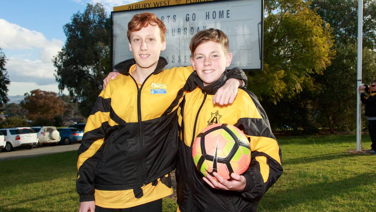 Albury West Public School captain Will Eden, who has Asperger's syndrome, with his mate Jacob Horne.  Picture: SIMON BAYLISS 