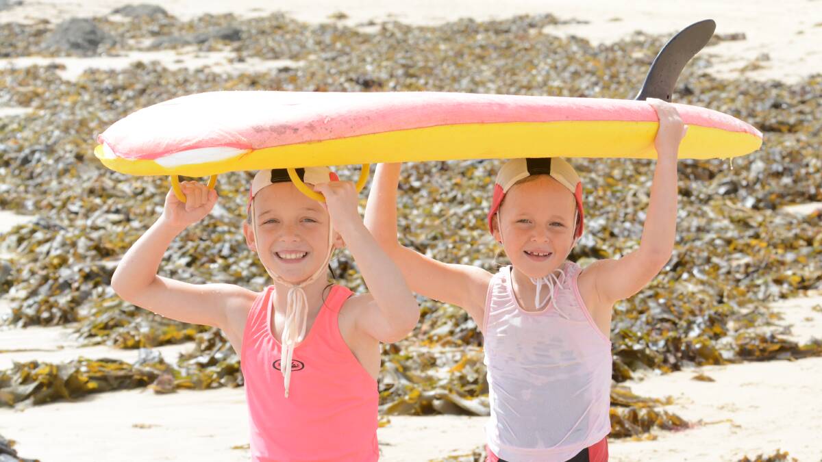Keep cool: The beach may be the best place to beat the extreme heat heading our way.  And you might find Nippers Miley Cox and Emily Castle on the beach at Black Head.