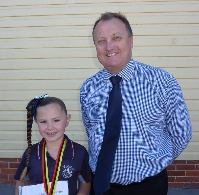 Forster Public School principal, Rick Clissold , presents Jasmine with her 2016 NAIDOC Medal of Excellence.