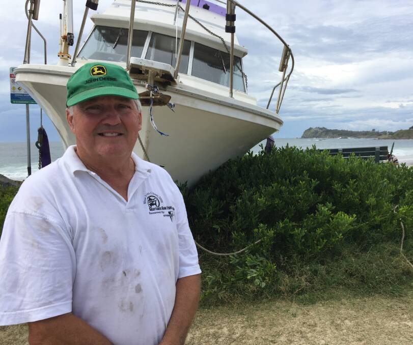Keen game fisherman and new owners of the stranded vessel Midnight Blue, Ossie Collins from Tuncurry and mate Ken Grezik called in the services of Great Lakes Cranes and truckie, Rob Fitzallan to help with the salvage operation.