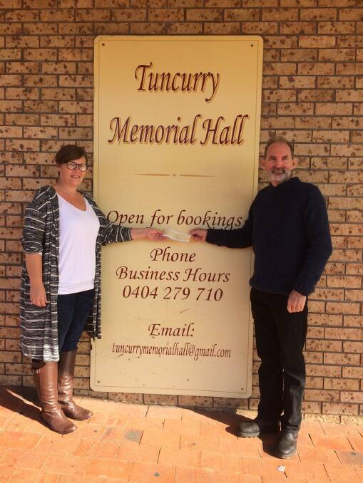 Forster-Tuncurry Labor Branch president , John Weate presents a cheque to the Tuncurry Memorial Committee president, Nyaree Donnelly.