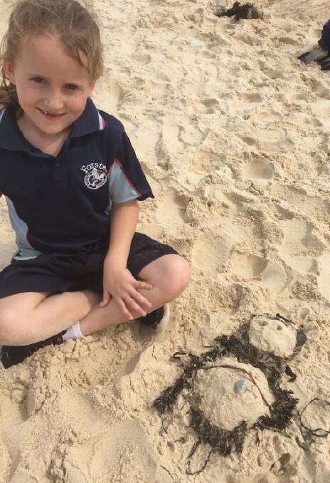Molly Tattersall sand modelling a turtle.