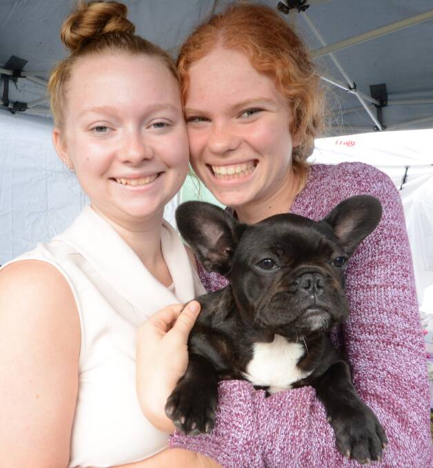 Olive gets a big, double cuddle from Brooke Lonergan and Bree Todd before braving the judge's assessment.