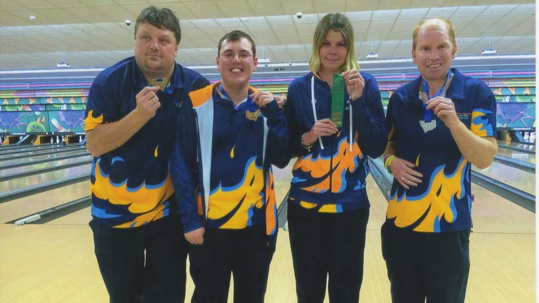Grant Percival, Jason Holley, Ellie Mugiven, Mitchel O’Neil hold their medals at the State level of the Special Olympics in Campbelltown. 