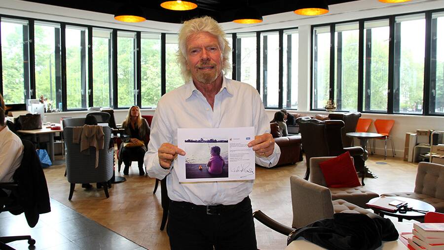 Recognition: Richard Branson pictured with Charlotte's photograph in the #GiveAFlyingDuck competition. It was taken at the BIG4 Holiday Park at Forster-Tuncurry.