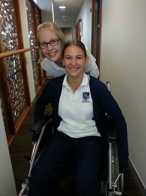 School captains Tamara Gooch and Kaitlyn Gregory tested assistive technologies such as modified cutlery, mobility putty and 3D diagnostic tools.