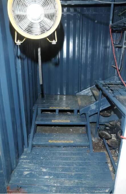 Inside the trapdoor, police walked down a set of sturdy stairs and into the three shipping containers where the cannabis was allegedly grown. Photo: Supplied