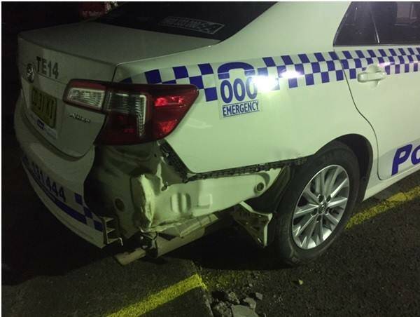 Rammed: The damaged police car. Photo: NSW Police Force
