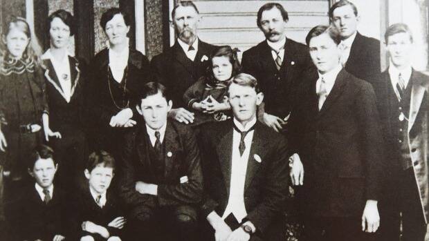 Family photograph, c.1880s, of Spencer and Eliza Cottee with their 11 children including Harold Warnock Cottee (first row, second from right). From the book Cottee's: A Family Favourite, Celebrating 75 Years.

