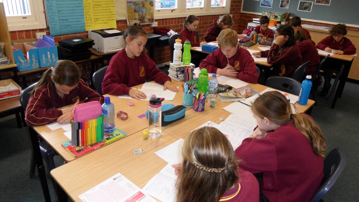 Students from Holy Name Primary School sit the maths exam.