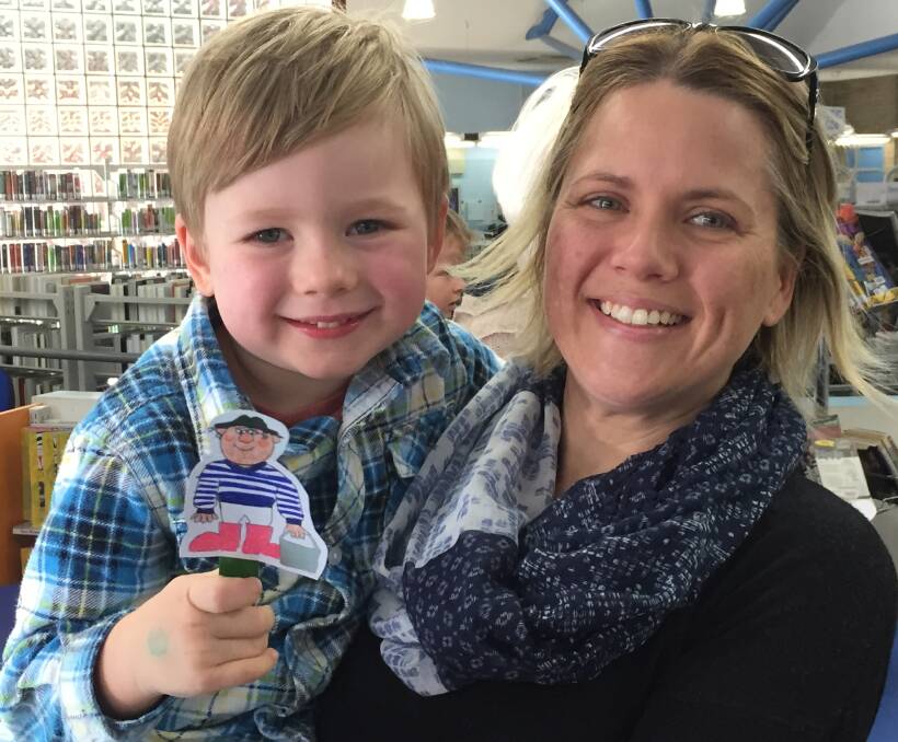 Taking home a 'puppet stick' four-year-old Jim Hamer with his mother Katie, from Tuncurry, couldn't hold back his smile.