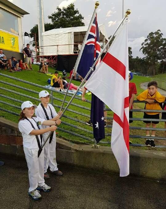 Big honour: Braith (back) carried the Australian flag for the second innings. He won a Cricket Australia competition to become a flag bearer.