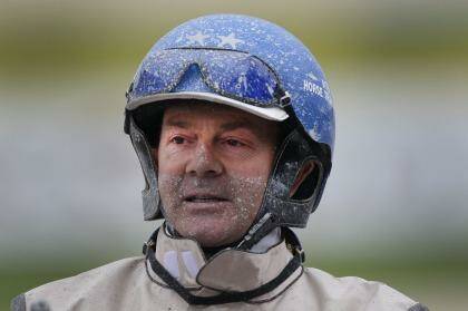 Driver Mark Purdon covered in mud after winning two group 1 races  at Alexandra Park.  Photo: Peter Meecham