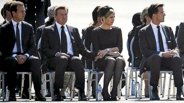 King Willem-Alexander and Queen Maxima (centre) mark the return of MH17 victims at Eindhoven. Photo: Phil Nijhuis