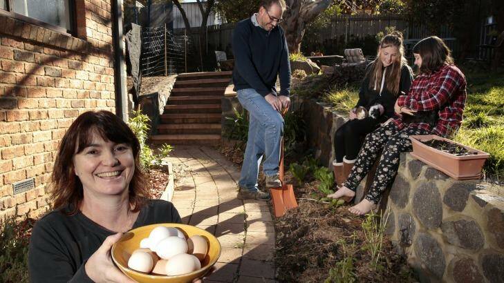 Jane Dickenson, Dave Anderson, Kerri Anderson and Ruby O'Hart in their compact garden. Photo: Jeffrey Chan