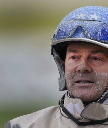 Driver Mark Purdon covered in mud after winning two group 1 races  at Alexandra Park.  Photo: Peter Meecham