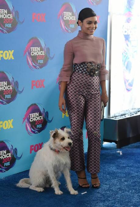 Vanessa Hudgens and Happy the Dog arrive at the Teen Choice Awards at the Galen Center on Sunday, Aug. 13, 2017, in Los Angeles. (Photo by Jordan Strauss/Invision/AP)