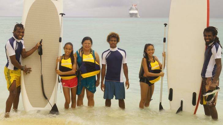 Carnival Spirit guests paddleboarding at Mystery Island. Photo: Supplied
