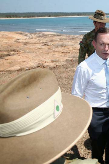 Prime Minister Tony Abbott meets with soldiers in North East Arnhem Land on Thursday. Photo: Alex Ellinghausen