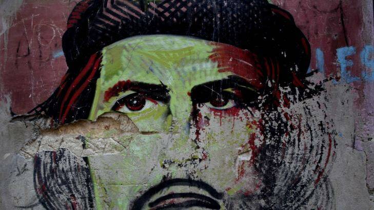 A Che Guevara painting on a house in Havana: The memory of socialism is quickly fading as US companies are gearing up to conquer the island nation.