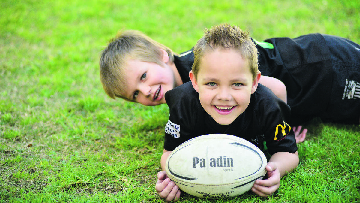 BEST BUDDIES: It has been a tough few months for Nate Wetini (with ball), the seven-year-old who suffered serious brain injuries when  a metal pole went through his head earlier this year, but through it all his best buddy Xavier Gollan has been right by his side. 