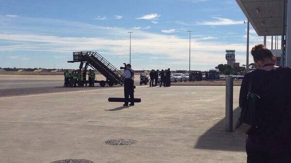 Media waits at the Edinburgh RAAF base for the Duke and Duchess of Cambridge to arrive.