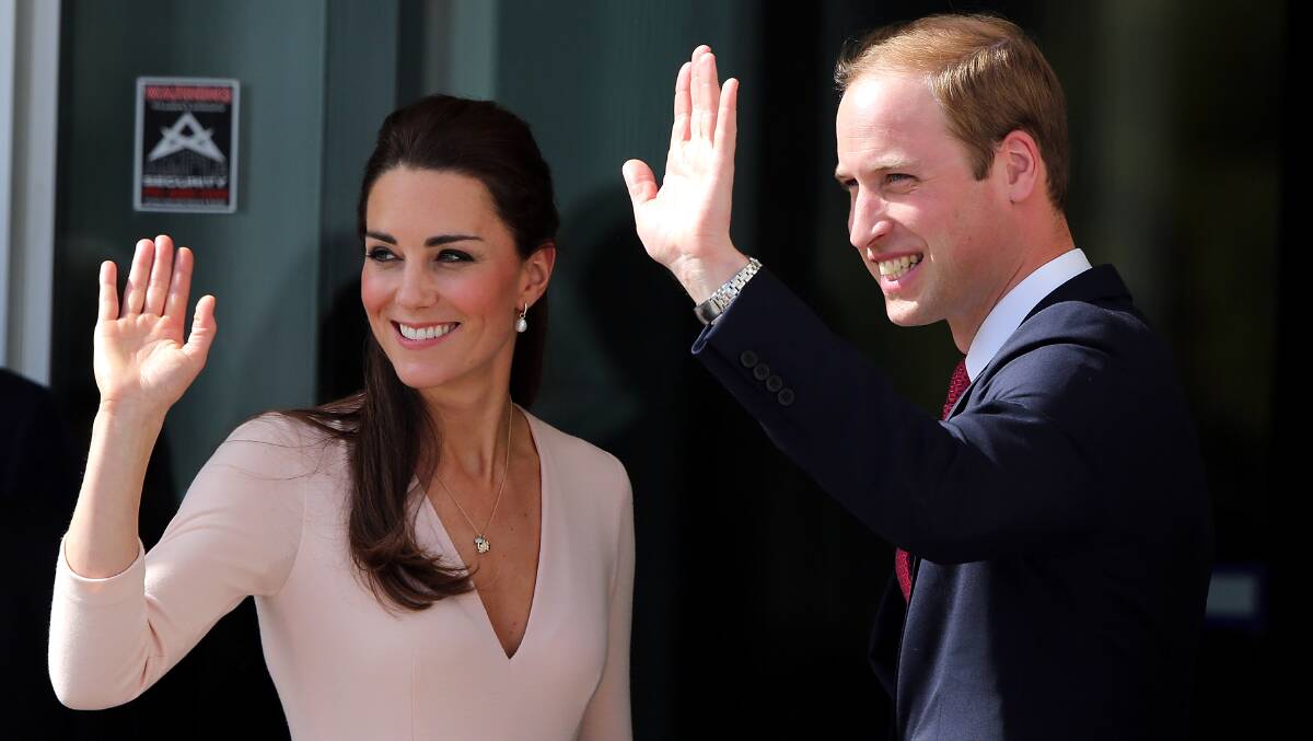 The Duke and Duchess of Cambridge wave to the crowd during their whirlwind trip to Adelaide's northern suburbs. Photo: Getty Images