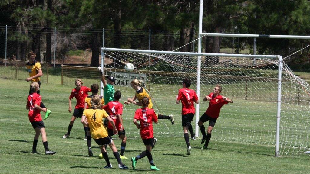 Tuncurry Forster Football Club’s under 17’s attack the Broadmeadow Magic NPL team’s goal in the recent clash at Harry Elliott Oval. 