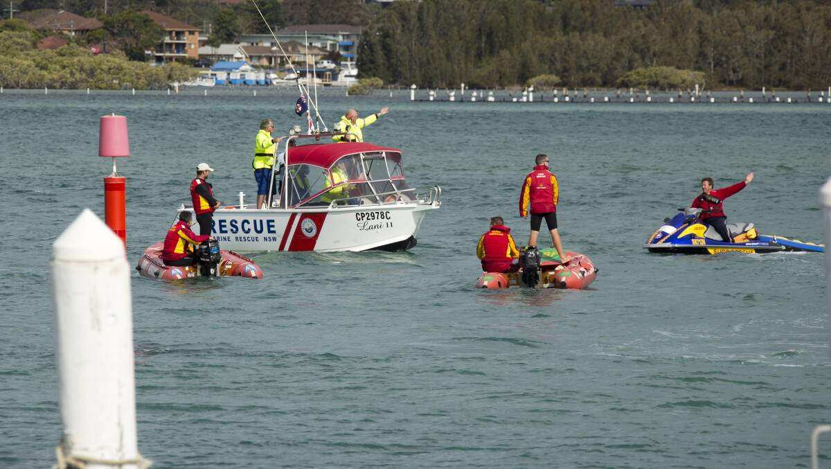 DESPERATE SEARCH: Rescuers scour the lake during the search last week for Sydney man William Lam. His body was found last Thursday near Regatta Island. Photo by Shane Chalker. 

