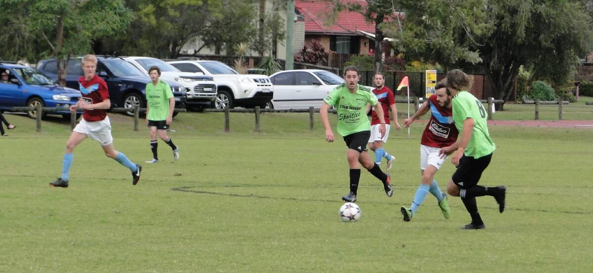 UNDEFEATED: Wallis Lake midfielder Blake Barnes Riddell, number six, gives chase with captain Beau Wynter, number eight, as midfielder Mitch Yarnold watches on. Wallis Lake beat Port FC 6-0 at Boronia Park on Saturday. The local side have remained unbeaten at home since round eight of last season.  