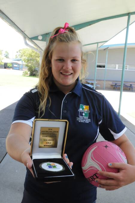 MEDAL WINNER: Ellie Johnston helped lead the NSW under-14s indoor netball team to victory at the Australian Junior Nationals held in Western Australia recently. Ellie is pictured with her medal from the championships. 
 