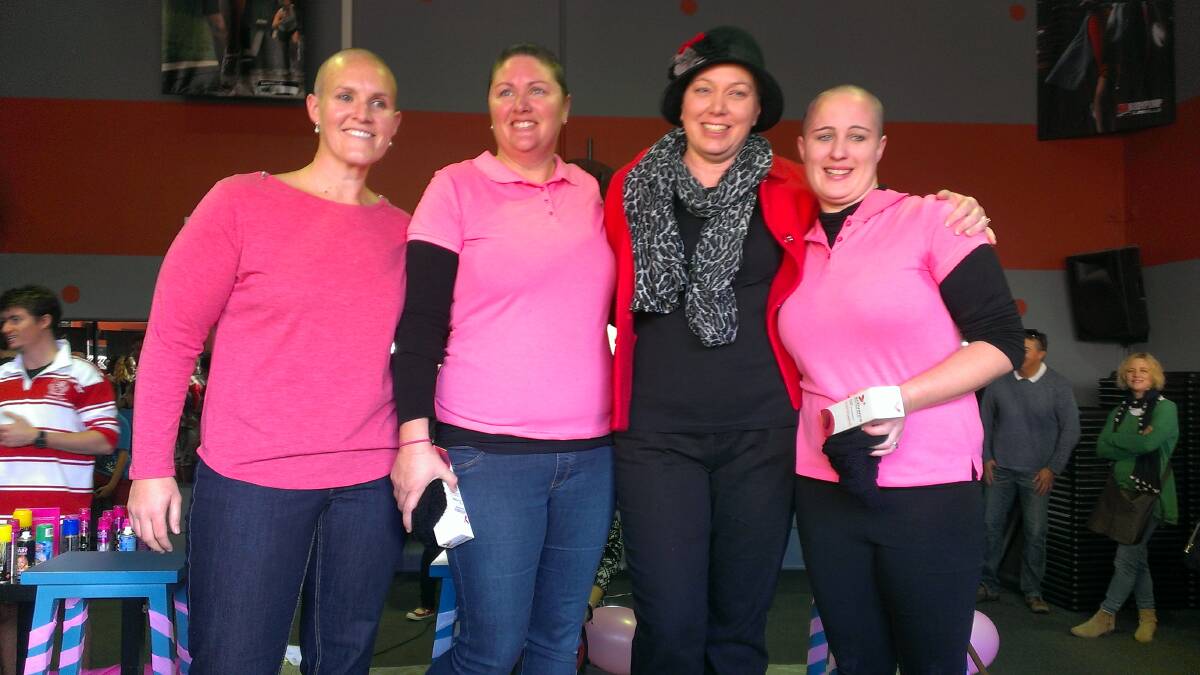 THEY DID IT: Lani Williams, Gillian Williams and Sarah Riddell shaved their heads in support of Megan McArthur (centre in black) and for breast cancer research.   