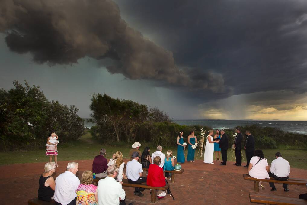 WILD STORM: Justin and Sheree (pictured above) had their wedding ceremony on Sunday afternoon at the Tanks in Forster when a wild storm broke out. Photo courtesy of Shane Chalker Photography. 