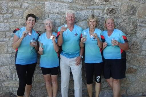 FIRST CLUB MEDAL: Wallis Spirit Dragon Boaters Pat Powell, Elaine Charker, Simone Kirk and Lee Newell picked up a bronze medal at the Flowing Festival Regatta in Jindabyne recently in the Masters Women’s category. They are celebrating with member Brian Cotterill who also attended the festival. 
 