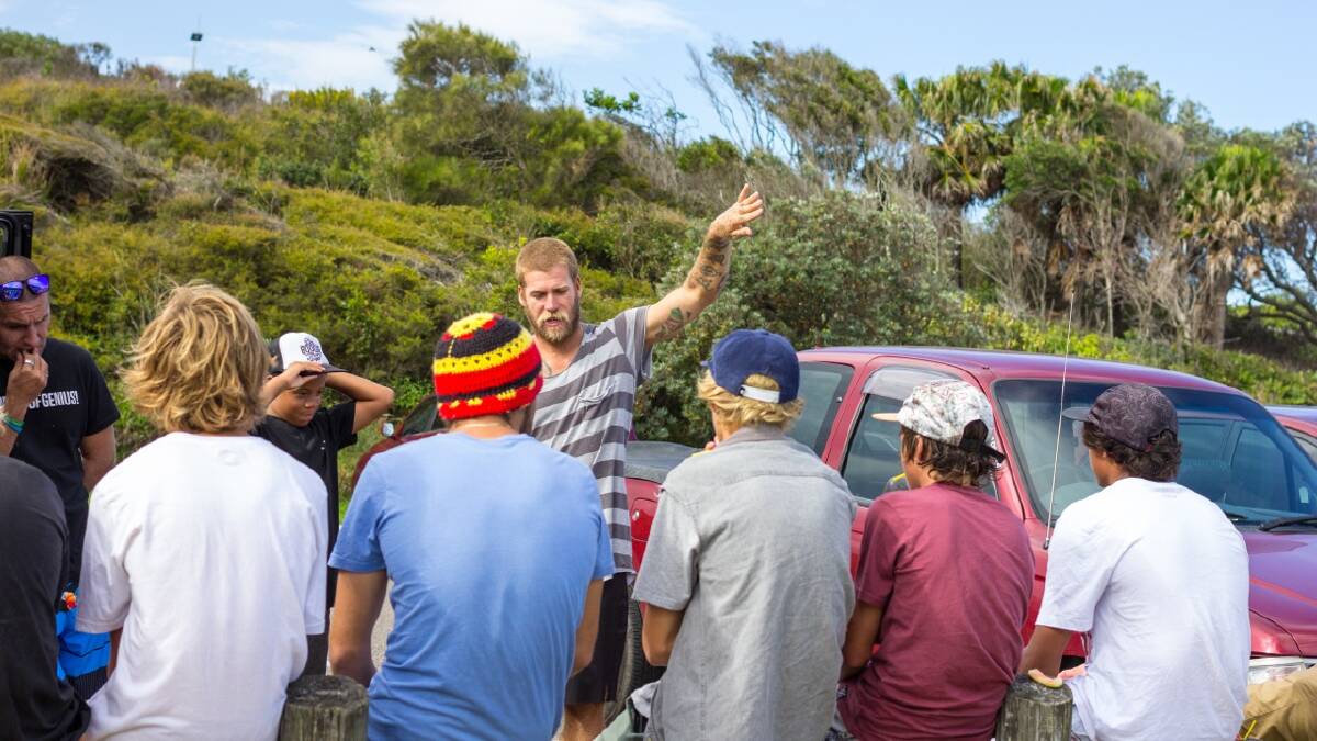 LISTEN UP: Bodyboard coach Heydon Bunting talks to the group about perfecting their skills in the water.  
 