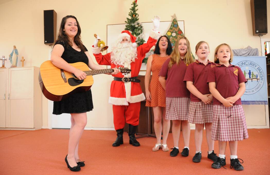 Nicola, Rachel, Alice, Emily and Sharon Fowle in rehearsals with Santa. The group will be singing Christmas carols at a free community luncheon at the Forster Tuncurry Parish Hall on Christmas Day. 
