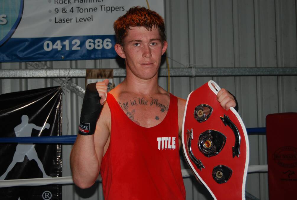 TITLE HOLDER: In his first ever competition fight, Forster boxer Guy Drinkwater overpowered Kurri Kurri’s Zac Thomson to take the Central NSW Middle Weight Title.  