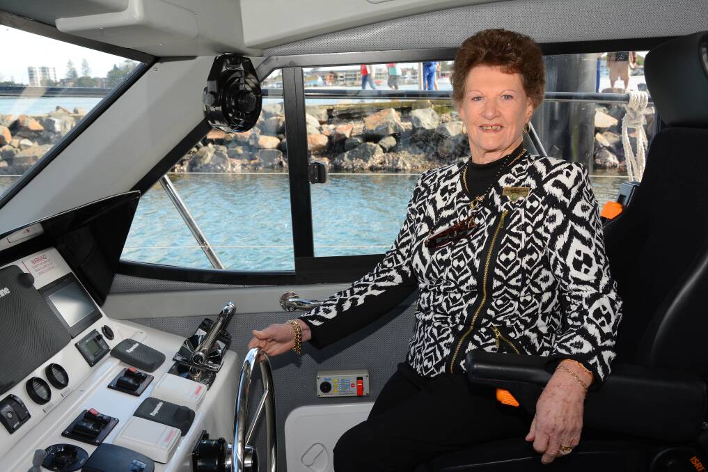 ALL ABOARD: Great Lakes mayor Jan McWilliams on the new Marine Rescue Forster Tuncurry vessel which was commissioned and handed over recently. 