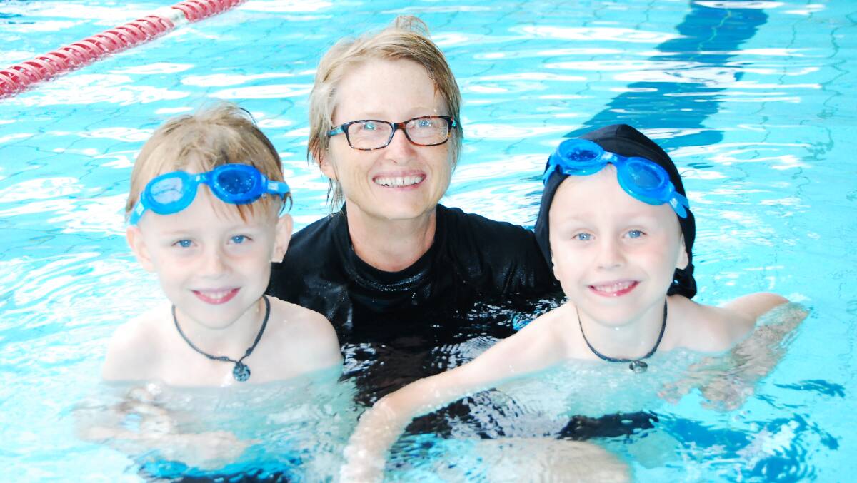 LOVE OF WATER: Six-year-old twin brothers Alec and Oliver Robertson enjoy a swimming lesson with their instructor Sharon Bourke as part of the Great Lakes Aquatic and Leisure Centre SwimAbility program. The centre will be holding YMCA’s annual Swimathon this Sunday to raise money for the program.   
