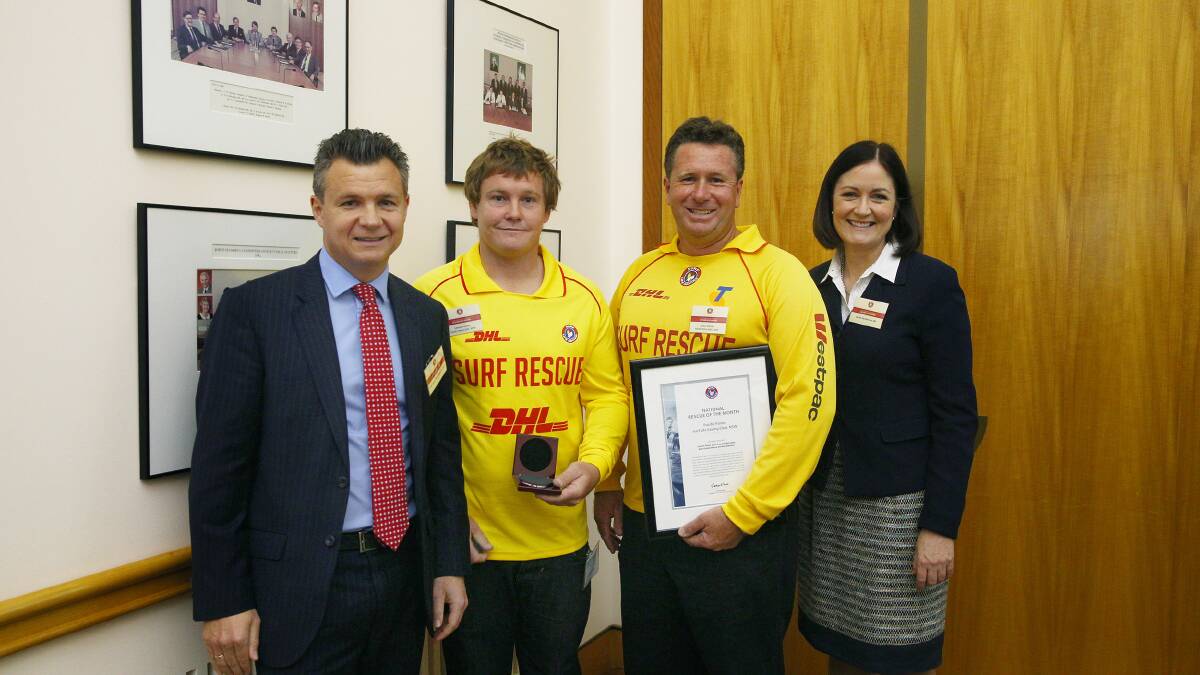 NATIONALLY RECOGNISED: Six local lifesavers recently received a national rescue award. Lifesavers Lennon Fisher and Brian Wilcox 
accepted the award on behalf of the Pacific Palms Surf Life Saving Club from Federal MPs Matt Thistlethwaite and Sarah Henderson at a ceremony in Canberra last week. Image from Steve Christo Photography.  