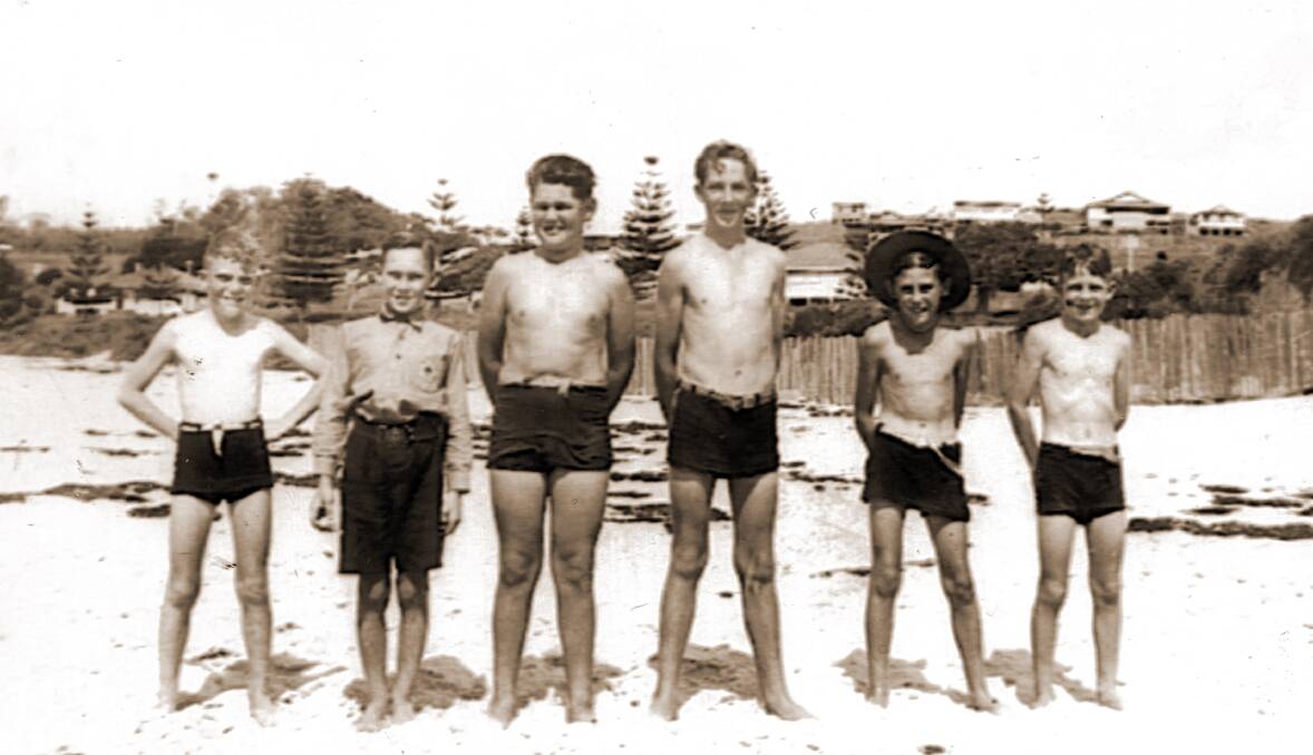 AT THE BEACH: Two boys identified in the photo are Bill Temple, pictured third from left, and Athol Paff, pictured fifth from left. There are no other names recorded so clickHistory volunteers would love to hear from you if you can identify any of the other boys in the photo. 