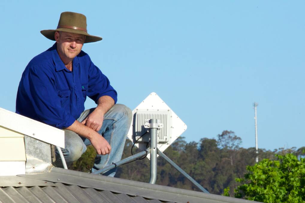 FRUSTRATED: A tower, a satellite, and a server are not enough to solve Adam Fardell’s NBN woes. 
 